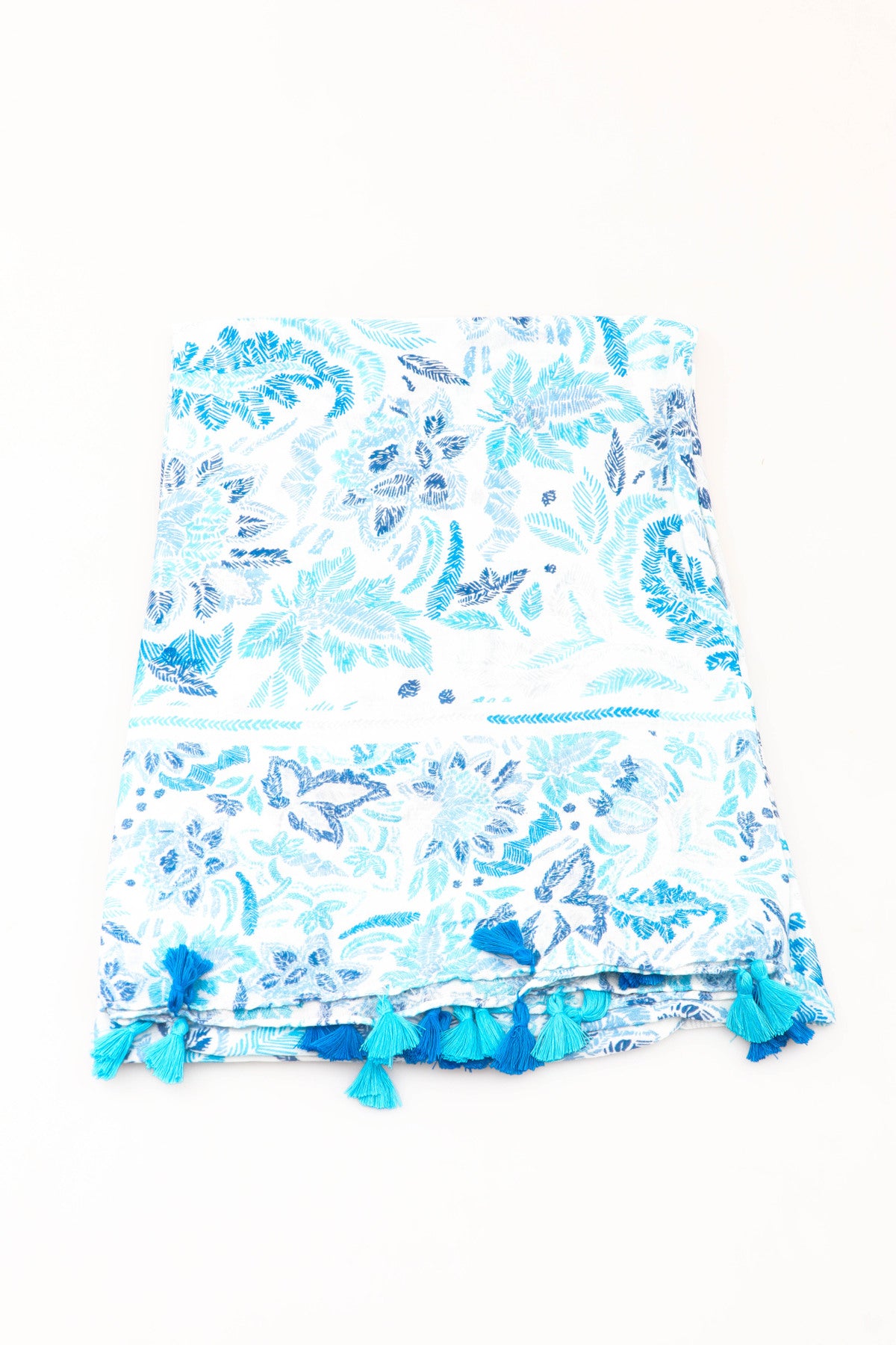 Blue and white floral patterned scarf with tassels on a white background