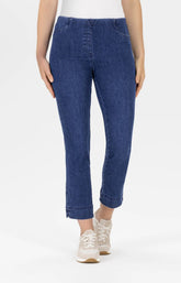 Blue jeans worn by a person on a white background