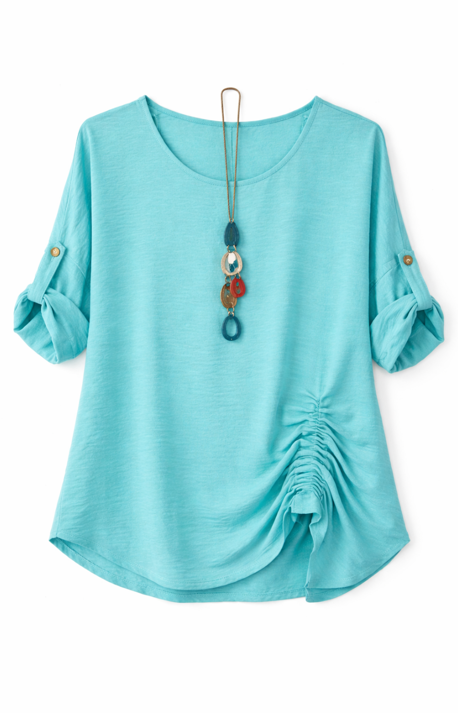 Mint blouse with rolled-up sleeves and a gathered detail on one side, accessorized with a long, colorful pendant necklace on a white background