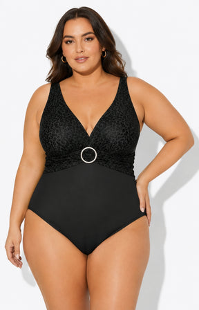 Woman wearing a black swimsuit with a white background