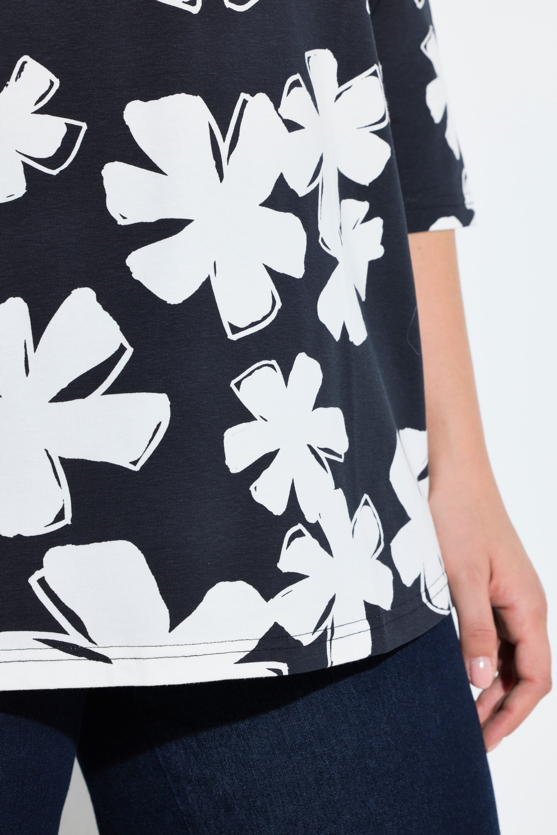 Ulla Popken Floral Keyhole Top in White, close up of navy top with white floral print with. 3/4 length sleeves