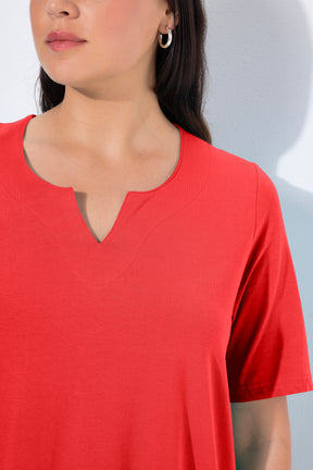 Close-up of a women wearing the Ulla Popken Tunic Neck T-Shirt in Red, a red shirt with a tunic neckline with short sleeves in a vibrant red shade