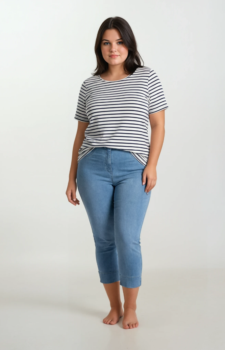 Woman wearing a striped shirt and blue jeans on a white background