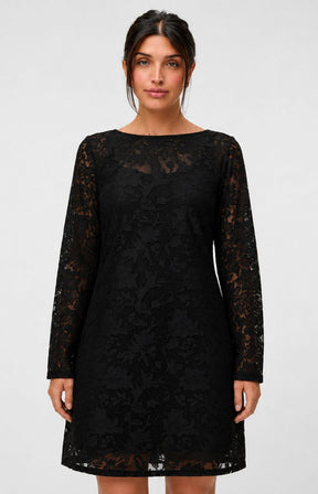 Model wearing the Vero Moda Curve Layla Dress in Black, a knee length black lace dress with a boat neckline and long sleeves. This image was created using AI 