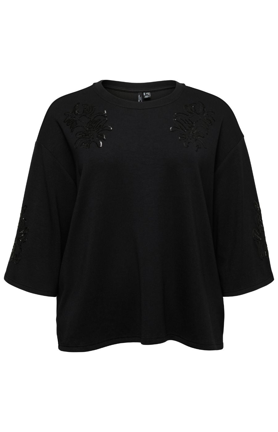 The Vero Moda Curve Nia Top in Black,  black oversized short-sleeve top with floral sequin applique details on the shoulders and sleeves, shown against a plain white background.