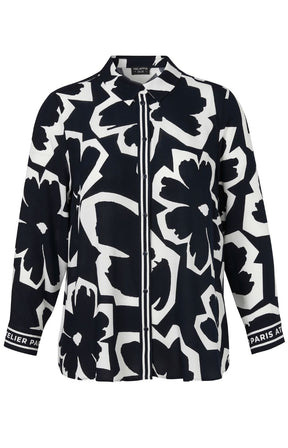 Navy and white floral patterned shirt with visible brand logo on a white background