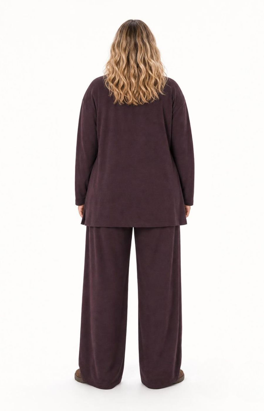 A woman viewed from the back wearing the Wasabi Sabina Pocket Cardigan in Brown a long-sleeve, long line cardigan standing against a plain white background. This image was created using AI