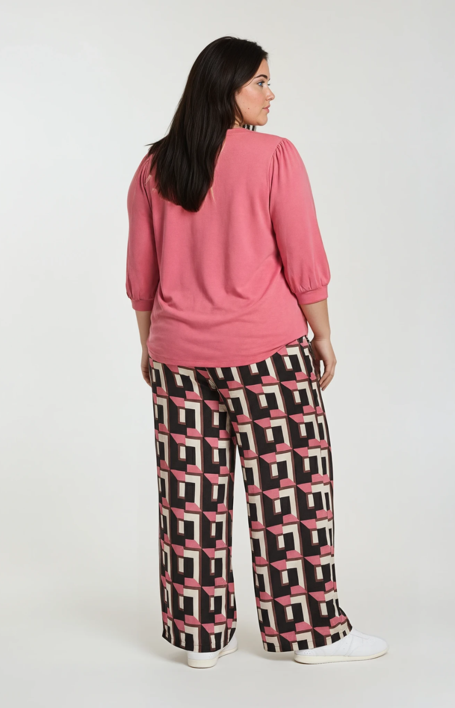 Wasabi Sarena Trousers in Pink, a wide leg trouser with button closure, side pockets and an all over geometric print
