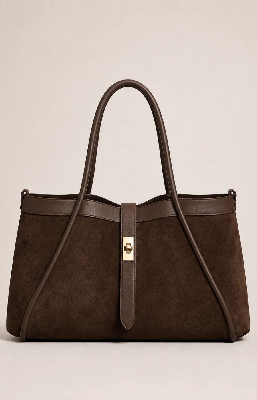 A dark brown suede tote bag with dark brown leather trim and handles, featuring a central gold-tone turn-lock clasp, photographed against a neutral light beige background.
