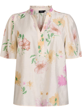 Floral blouse with pastel colors on a white background